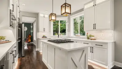 Quartz countertops, Cafe appliances, lighted cabinets & floating shelves make this kitchen a chef's dream!