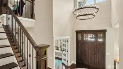 Statement chandelier and front door greet you.