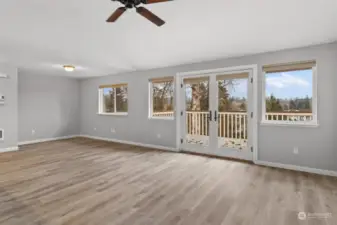 Living room off kitchen. Slider leads to deck with a view!