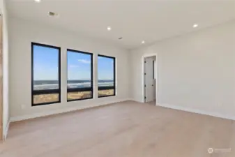 Large primary bedroom with unforgettable view