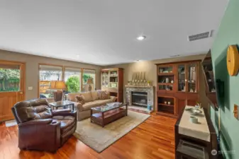 Of course the family/rec room also has hardwoods, great natural windows, recessed lighting and access to patio & the back yard. Another fun action zone!