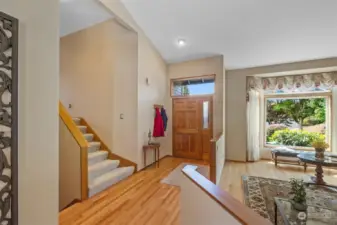 Upon entry the foyer embraces you & is highlighted by gleaming natural hardwood flooring