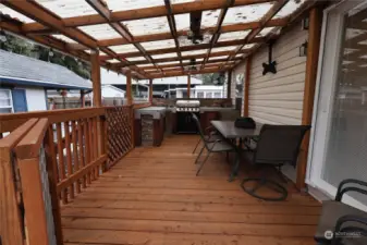 Outdoor kitchen with eating area.