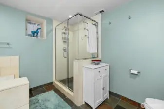 Primary bathroom with separate shower. This bath and the main floor bath have heated slate-tiled floors.