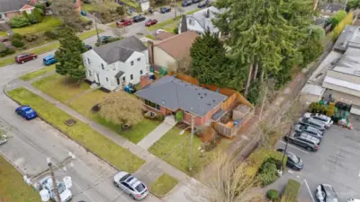 Drone photo at higher elevation with car parked perpendicular to the curb cut.