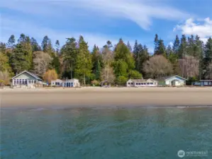 156 feet of waterfront and that sugar sand beach.  Three buildings in the middle are the waterfront part of the compound.