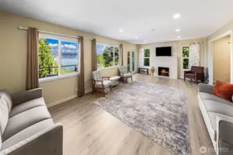 An expansive open living room & lake views upon entry.