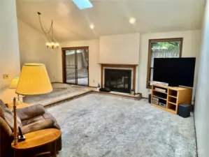 Heat vent in dining room is the easiest place to see the hardwoods under carpet.  JUST REMOVE THE HEAT VENT COVER & TAKE A PEEK!