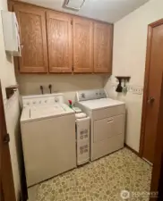Utility room with door that leads to the garage.