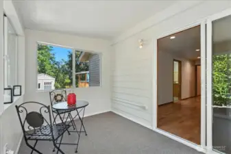 Sun Porch Looks out onto Back Yard