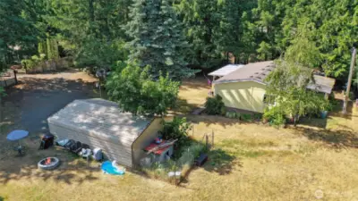 Carport has great dog run or garden space behind it.
