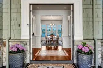 The inviting entry opens straight into the dining room with French doors opening straight to the east facing deck.