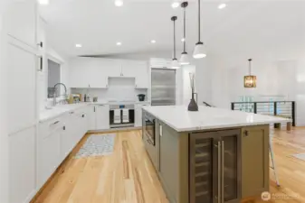 This kitchen has it all. Wine frig, highend appliances and full height backsplash.