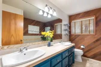 Full bath with large soaking tub and double vanity, handsome cedar panelling