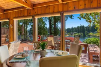 What a view from the dining table! All of these beautiful floor to ceiling windows to bring in the light and nature.