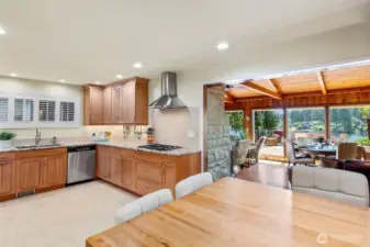 You will want for nothing in this beautifully remodeled kitchen. Custom reclaimed Madrona wood table shown in the foreground. Views of the lake from here!
