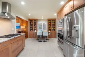 More custom built ins at the end of the kitchen. This second dining area has a view to the lake and is a great spot for casual meals, homework, games and puzzles....right in the heart of the action!