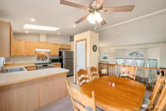 Kitchen has a skylight and pantry