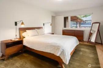 Unwind in the gorgeous primary suite, equipped with ample closet space, a primary bath, and views of Lake Washington.