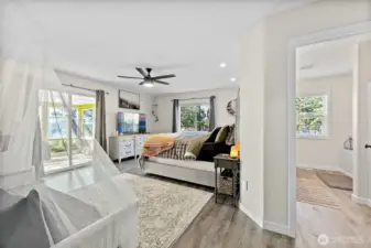 Huge Primary Suite with Private Bath & Sunroom Access.