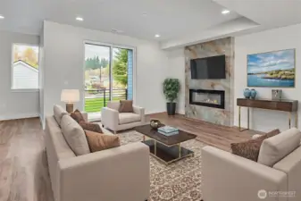 Large living space on main level with access to covered deck. Virtually staged.