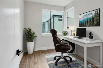 Home office or 5th bedroom on main floor. Virtually staged