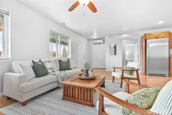 Windows in living room look out to covered country front porch