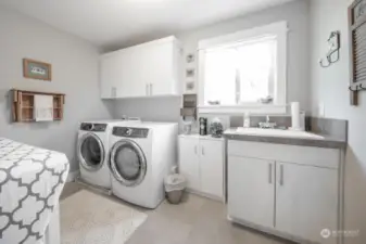 Laundry room conveniently located on the second level.