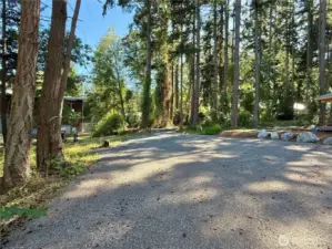 30' wide easement driveway over neighbor's parcel leads to lot.