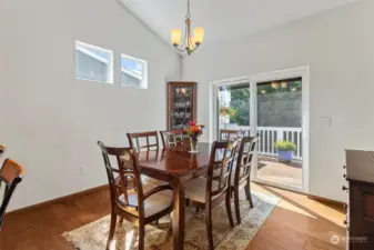 View to the back deck and greenbelt from the kitchen and dining room. Nice big wall for a hutch too.