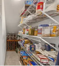 Love this versatile closet off the kitchen, It is a coat closet and pantry/storage area.