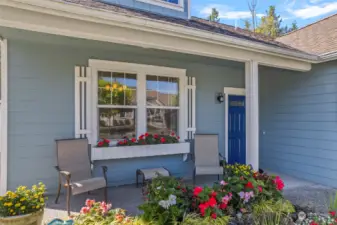 Gorgeous flowers surround this home