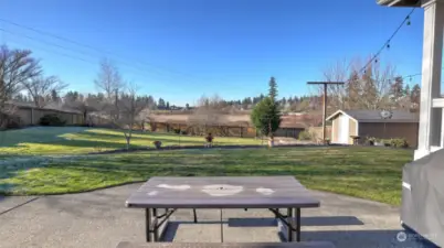 An inviting outdoor dining setup in the backyard, perfect for al fresco meals.