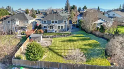 A breathtaking aerial shot highlighting the home's expansive layout and generous green space.