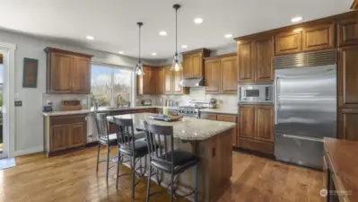 A beautifully designed kitchen with a tiled island and stylish seating for casual dining.