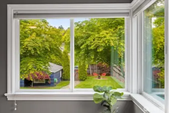 Wake up to lush green scenery and a peek into the private backyard oasis.