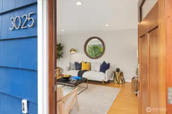 Step through the solid wood door into a bright and inviting living space with timeless style.
