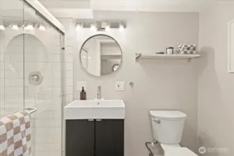 An updated powder room adjacent to the office makes this lower level ideal for long workdays or visiting guests.
