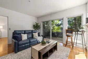The main living area opens up to the private balcony + ~410sqft wrap-around deck.