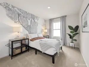 Secondary bedroom showcases a striking city-map mural, ample natural light, and plush carpeting—ideal for guests or a creative retreat. Pictures are for representational purposes only, colors and features may vary.