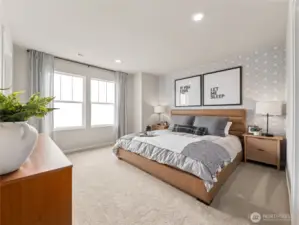 Primary suite delivers king-size comfort with patterned feature wall, twin windows, and soft neutral décor for a calming oasis. Pictures are for representational purposes only, colors and features may vary.