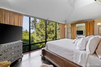 Spacious primary bedroom suite with expansive views.