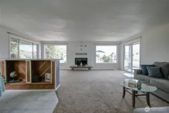 View from the entrance area showing how large the living room is and bar/dining room.