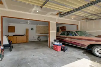 Picture of the large 2 car garage with a work area.