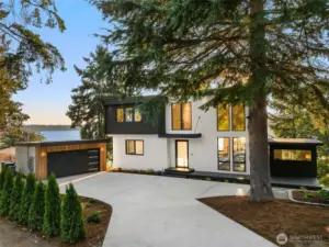 Modern curb appeal – A bold façade with sleek lines, circular driveway, and striking architecture that makes a lasting first impression.