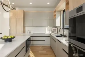 Clean lines – Handle-free cabinetry and modern finishes showcase thoughtful design.