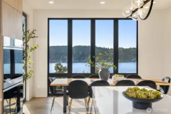 Dining with a view – Floor-to-ceiling windows set the stage for every meal.