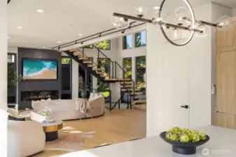 Architectural artistry – The floating stair anchors a living space filled with light.
