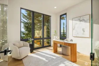 Work inspired – A private glass-walled office framed by natural light and serene views.