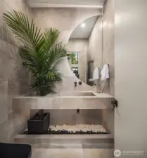 A sculptural sanctuary: this powder room blends stone, greenery, and bold geometry into a serene statement of modern design